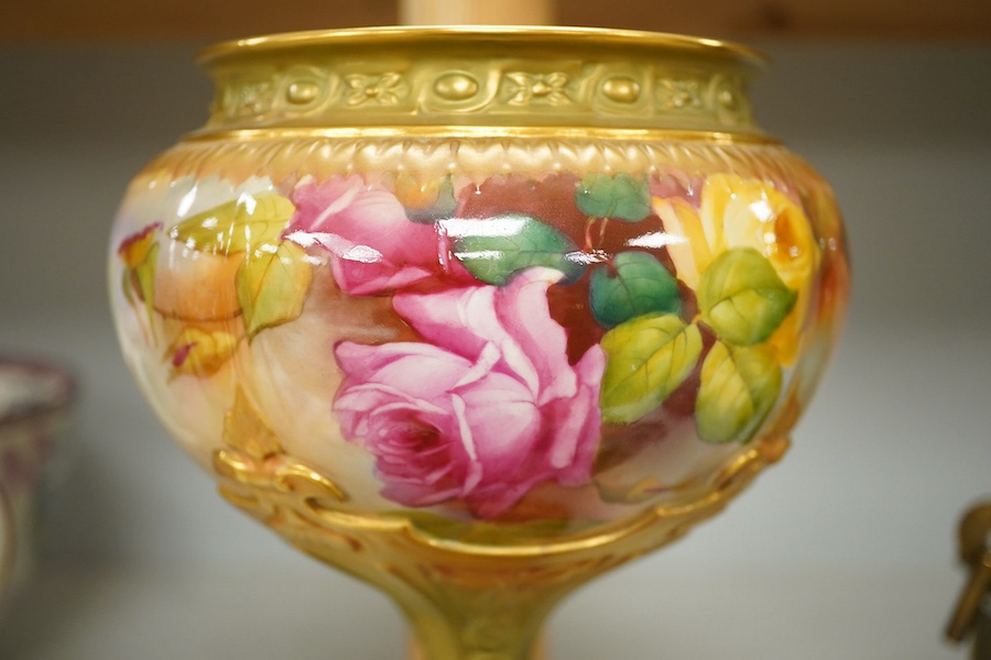 A Royal Worcester pedestal vase decorated with roses, marked to the base 1813 10.54. Condition - good.